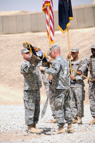 U.S. Army Colonel Sean M. Jenkins, Task Force Currahee commander, 4th Brigade Combat Team, 101st Airborne Division, and U.S. Army Command Sgt. Maj. Timothy Coop, TF Currahee command sergeant major, uncase the brigade and regimental colors during a Transfer of Authority ceremony at Forward Operating Base Sharana Sept. 8th. TF Currahee took over Paktika Province from TF Rakkasan, 3rd BCT, 101st Airborne Div., as one of the last brigades deployed to support the Operation Enduring Freedom troop surge. (Photo by U.S. Army Spc. Kimberly K. Menzies, Task Force Currahee Public Affairs, 4th Brigade Combat Team, 101st Airborne Division)