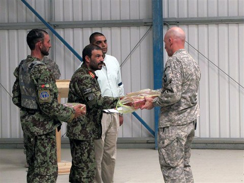 U.S. Army Lt. Col. David Fivecoat, and Afghan National Army Commander Zamaray exchange gifts of gratitude for their partnership over the past six months in Paktika Province. On Sept. 10th, Task Force Iron Rakkasan, 3rd Battalion, 187th Infantry, 3rd Brigade from the 101st Airborne Division, conducted the official transfer of authority ceremony for western Paktika Province to Task Force Red Currahee, 1st Battalion, 506th Infantry, 4th Brigade from the 101st Abn. Div. (Photo by U.S. Army 1st Lt. R.J. Peek, 3rd Battalion, 187th Infantry, 101st Airborne Division)