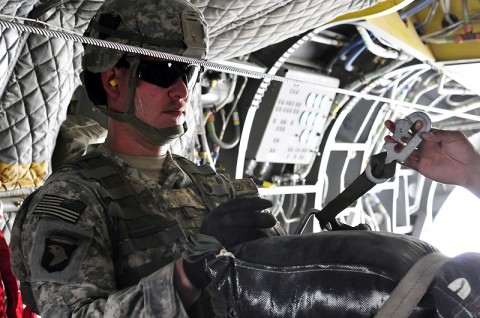 The jumpmaster waits for the Chinook pilots to give the order to “execute” the airdrop before pushing the bundle out the back of the aircraft