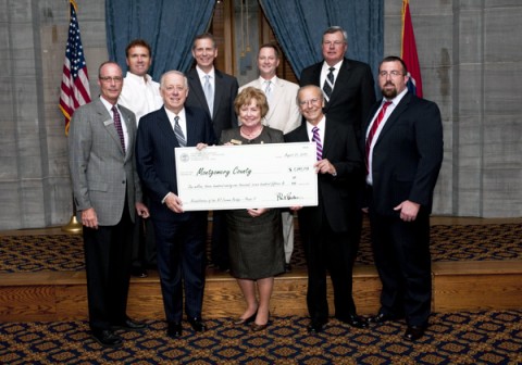 (L to R, top row): Rep. Phillip Johnson (R-Pegram), Rep. Joe Pitts (D-Clarksville), Sen. Tim Barnes (D-Adams), Rep. Curtis Johnson (R-Clarksville), (bottom row, L to R) Phil Harpel, Governor Phil Bredesen, Montgomery County Mayor Carolyn Bowers, TDOT Commissioner Gerald Nicely and Clint Camp present Montgomery County's TDOT Enhancement Grant on Tuesday, Aug. 31st, at the Old Supreme Court Chambers in Nashville.