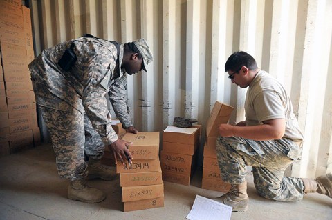 U.S. Army Spc. Cornelius Miller, Headquarters and Headquarters Company, 1st Battalion, 187th Infantry Regiment supply clerk, from Miami, and U.S. Army Spc. Anthony De Leon, Headquarters and Headquarters Company, 1st Battalion, 187th Infantry Regiment, communications specialist from Harlington, Texas, inventory radios to be sent out to their battalion’s companies Sept. 16th on Bagram Airfield. (Photo by U.S. Army Pfc. Chris McKenna, 3rd Brigade Combat Team)