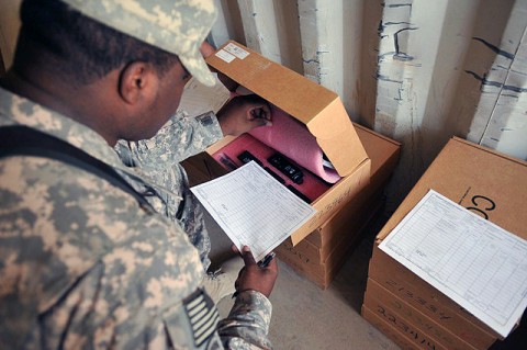 U.S. Army Spc. Cornelius Miller, Headquarters and Headquarters Company, 1st Battalion, 187th Infantry Regiment supply clerk, from Miami, inventories serial numbers on radios that are set to be sent to his battalion’s companies to help assist during the remainder of their deployment. (Photo by U.S. Army Pfc. Chris McKenna, 3rd Brigade Combat Team)