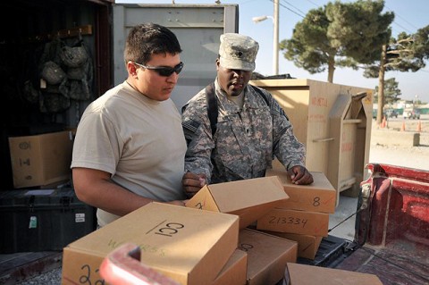 U.S. Army Spc. Cornelius Miller, Headquarters and Headquarters Company, 1st Battalion, 187th Infantry Regiment supply clerk, from Miami, and U.S. Army Spc. Anthony De Leon, Headquarters and Headquarters Company, 1st Battalion, 187th Infantry Regiment, communications specialist from Harlington, Texas, inventory radios to be sent out to their battalion’s companies Sept. 16th on Bagram Airfield. (Photo by U.S. Army Pfc. Chris McKenna, 3rd Brigade Combat Team)