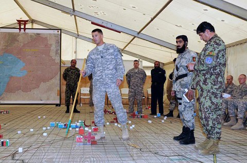 U.S. Army Capt. Joe Malone, native of Fairfield, Ohio, and company commander, Company A, 3rd Special Troops Battalion, 3rd Brigade, 101st Airborne Division, points out his areas of responsibility during an Election Combined Arms Rehearsal meeting Sept. 15th at Forward Operating Base Salerno. (Photo by U.S. Army Sgt. Brent C. Powell, 3rd Brigade, 101st Airborne Division)