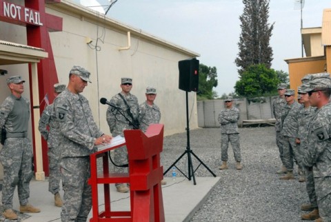 U.S. Army Chaplain (Maj.) Tom Faichney, from Toronto, 3rd Brigade Combat Team, leads a group of Soldiers in prayer during a memorial service remembering the 9/11 attacks exactly nine years later Sept. 11th. “As we reflect here this afternoon, we realize that the events of nine years ago continue to have repercussions on this very day,” Faichney said. (Photo by U.S. Army Pfc. Chris McKenna, 3rd Brigade Combat Team)