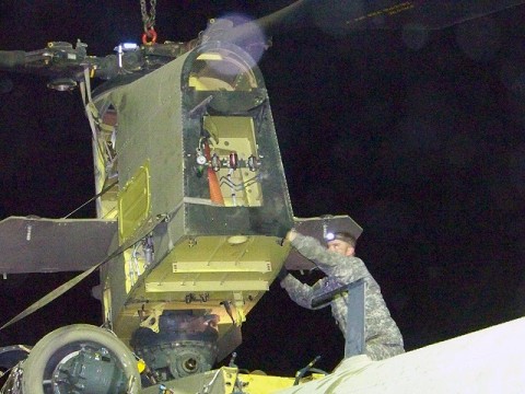 Camp Blackhorse, Afghanistan – U.S. Army Sgt. Jeffery Wafer, a Chinook helicopter repair technician with Company B, Task Force Workhorse, 3rd Combat Aviation Brigade, TF Falcon, from Edgewood, NM, helps remove the aft pylon from a damaged Chinook helicopter July 26th on Camp Blackhorse. (Photo by U.S. Army Maj. Heather Weigner, Task Force Workhorse, 3rd Combat Aviation Brigade, TF Falcon) Camp Blackhorse, Afghanistan – U.S. Army Sgt. Jeffery Wafer, a Chinook helicopter repair technician with Company B, Task Force Workhorse, 3rd Combat Aviation Brigade, TF Falcon, from Edgewood, NM, helps remove the aft pylon from a damaged Chinook helicopter July 26th on Camp Blackhorse. (Photo by U.S. Army Maj. Heather Weigner, Task Force Workhorse, 3rd Combat Aviation Brigade, TF Falcon)