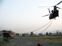 Camp Blackhorse, Afghanistan – A U.S. Army Chinook helicopter from Company B, Task Force Knighthawk, 3rd Combat Aviation Brigade, TF Falcon, hooks up to a sling a damaged Chinook July 27th on Camp Blackhorse. (Photo by U.S. Army Maj. Heather Weigner, Task Force Workhorse, 3rd Combat Aviation Brigade, TF Falcon)