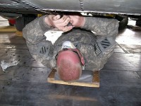 Bagram Airfield, Afghanistan – U.S. Army Pfc. Benjamin Raschke, a Black Hawk helicopter repair technician with Company B, Task Force Workhorse, 3rd Combat Aviation Brigade, TF Falcon, from Grass Valley, CA, removes proseal from a Black Hawk Aug. 15th on Bagram Airfield. (Photo by U.S. Army Sgt. Ryan Gillette, Task Force Workhorse, 3rd Combat Aviation Brigade, TF Falcon)