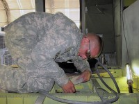 Bagram Airfield, Afghanistan – U.S. Army Spc. Christopher Tirini, an aircraft structural repair technician with Company B, Task Force Workhorse, 3rd Combat Aviation Brigade, TF Falcon, from Rockaway, NJ, repairs a bullet hole in a Black Hawk helicopter Aug. 19th on Bagram Airfield. (Photo by U.S. Army Sgt. Ryan Gillette, Task Force Workhorse, 3rd Combat Aviation Brigade, TF Falcon)