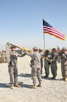 U.S. Army Lt. Col. William B. Johnson of Bruceton, TN, Task Force Panther commander, and U.S. Army Command Sgt. Maj. Anthony R. Broadhead of Clarksville, TN, uncased their battalion colors at Forward Operating Base Connolly here Sept. 14.  (Photo by U.S. Army Spc. Richard Daniels Jr., Task Force Bastogne Public Affairs)