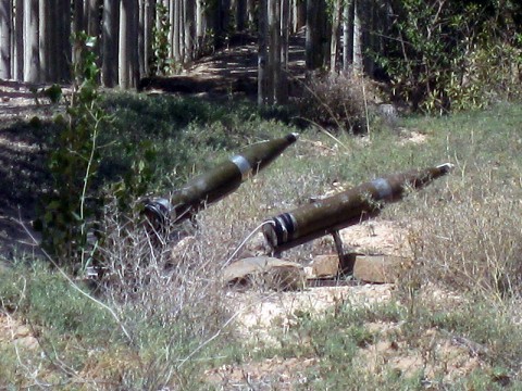 Two rockets sit hidden in a stand of trees, poised to strike Forward Operating Base Sharana. The rockets were discovered and destroyed recently, and the man responsible, Taliban commander Attullah, was captured in a joint operation with Soldiers from Task Force Iron and Afghan security forces.  (U.S. Army courtesy photo)