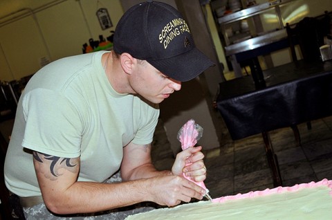 U.S. Army Sgt. Bill McDonald decorates a cake Joint Operations Center’s in the dining facility on Bagram Airfield Oct. 18th. McDonald is a 28-year-old Quincy, IL, native and a baker in the Combined Joint Task Force 101 commander’s DFAC. (Photo by U.S. Army Sgt. Scott Davis, Regional Command East Public Affairs)