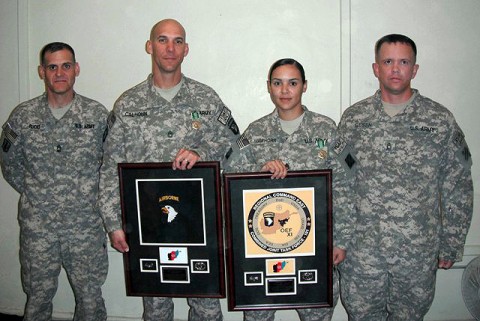 U.S. Army Sgt. 1st Class Matthew Calhoun (center left) of Visalia, CA, 2nd Brigade Combat Team, Task Force Strike, was selected as the 101st Airborne Div. Career Counselor of the Year; and U.S. Army Staff Sgt. Yelixa Mawhorr (center right) of Brooklyn, NY, 3rd Combat Aviation Brigade, Task Force Falcon, was selected as the RC-East Career Counselor of the Year here Oct. 14th. (Photo courtesy of the U.S. Army)