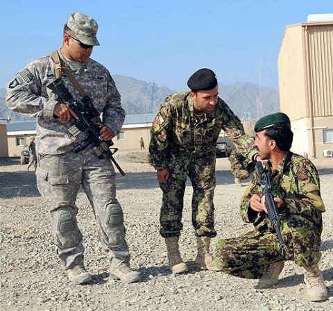 U.S. Army Sgt. Pedro Rodriguez-Ortiz, a native of Los Angeles, CA, and a squad leader for 1st Squad, 1st Platoon, Company C, 1st Squadron, 33rd Cavalry, watches as his Afghan counterpart Staff Sgt. Zaratgul Tofan, an Afghan National Army squad leader and native of Kabul Province, gives instructions to one of his squad members during patrol training at Camp Parsa Oct. 4th.  (Photo by U.S. Army Staff Sgt. Brent C. Powell, 3rd Brigade, 101st Airborne Division)