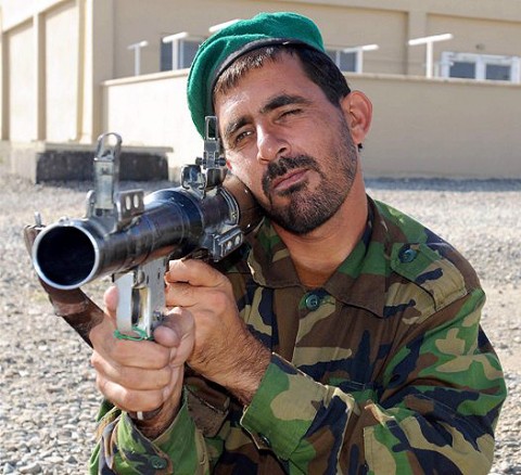 An Afghan National Army soldier from Headquarters and Headquarters Company, keeps watch for enemy movement during recent squad patrol training taught by U.S. Soldiers from Company C, 1st Squadron, 33rd Cavalry. For the past six-months the two units have conducted joint operations together, training and fighting side by side. (Photo by U.S. Army Staff Sgt. Brent C. Powell, 3rd Brigade, 101st Airborne Division)