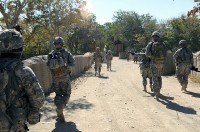 Task Force Currahee Soldiers from Company C, 1st Battalion of the 506th Infantry Regiment, 4th Brigade Combat Team, 101st Airborne Division are led out of Forward Operating Base Khayr-Khot Castle by Afghan National Army soldiers on a presence patrol to the city of KKC Oct. 6th. (Photo by U.S. Army Spc. Luther L. Boothe Jr., Task Force Currahee Public Affairs, 4th Brigade Combat Team, 101st Airborne Division)