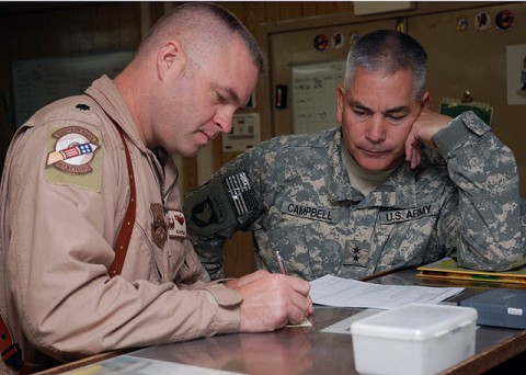 U.S. Army Maj. Gen. John F. Campbell, Combined Joint Task Force 101, Regional Command East commander, receives an initial briefing for an upcoming flight on an F-15E Strike Eagle from U.S. Air Force Lt. Col. Allan A. Nilles, 336th Expeditionary Fighter Squadron commander, Oct. 20th. (Photo by U.S. Air Force Tech. Sgt. M. Erick Reynolds, Regional Command East Public Affairs)