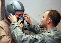 U.S. Air Force Senior Airman KevCombined Joint Task Force 101, Regional Command East commander, with final adjustments to his flight helmet here Oct. 21st before going on a familiarization flight in an F-15E Strike Eagle. (Photo by U.S. Air Force Tech. Sgt. M. Erick Reynolds, Regional Command East Public Affairs)