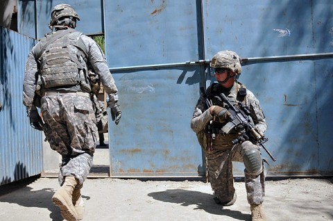 U.S. Army Sgt. Christopher L. Dixon, of San Antonio, a section sergeant with 1st Platoon, Company D, 2nd Battalion, 327th Infantry Regiment, Task Force Spartan, provides security while Soldiers from his unit prepare to board their vehicles, Sept. 26th. His unit visited a school in the Goshta District in eastern Afghanistan’s Nangarhar Province to donate school supplies and recreational items. (Photo by U.S. Army Sgt. Albert L. Kelley, 300th Mobile Public Affairs Detachment)