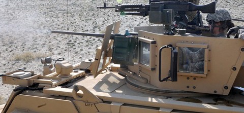 U.S. Army Spc. Tara M. Morrow of Erie, PA, Corps of Engineers, Alpha Company, 1st Detachment, 128th Brigade Support Battalion, fires a M240B machine gun at a heavy weapons range in eastern Afghanistan’s Nangarhar Province, October 11th.  (Photo by U.S. Army Spc. Richard Daniels Jr., Task Force Bastogne Public Affairs)