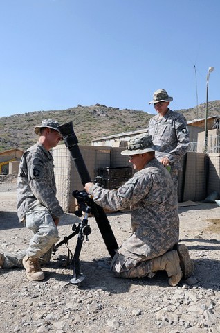 U.S. Army Pfc. Armando J. Ramos, a mortarman with the 101st Airborne Division, and U.S. Army Spc. Michael W. Dough, a mortarman also with the 101st Airborne Div., are inspected by U.S. Army Sgt. David A. Ramirez, Sept. 27th on Combat Outpost Munoz. (Photo by U.S. Army Spc. Luther L. Boothe Jr., Task Force Currahee Public Affairs Office) U.S. Army Pfc. Armando J. Ramos, a mortarman with the 101st Airborne Division, and U.S. Army Spc. Michael W. Dough, a mortarman also with the 101st Airborne Div., are inspected by U.S. Army Sgt. David A. Ramirez, Sept. 27th on Combat Outpost Munoz. (Photo by U.S. Army Spc. Luther L. Boothe Jr., Task Force Currahee Public Affairs Office)