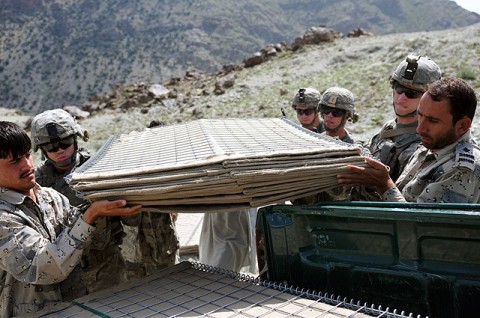 U.S. Army Soldiers with 1st Platoon, Company A, 2nd Battalion, 327th Infantry Regiment, Task Force Spartan, help Afghan Border Police load blast wall barriers onto the back of an ABP vehicle Sept. 27th. (Photo by U.S. Army Sgt. Albert L. Kelley, 300th Mobile Public Affairs Detachment)