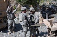 U.S. Army Staff Sgt. Rashad A. Lewis, of Miami, FL, a squad leader with 2nd Platoon, Company D, 2nd Battalion, 327th Infantry Regiment, Task Force Spartan, directs his soldiers as they hook up a tow bar to free a stuck mine resistant ambush protected vehicle Sept. 28th. (Photo by U.S. Army Sgt. Albert L. Kelley, 300th Mobile Public Affairs Detachment)