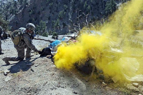 Army Lt. Col. Stephen Lutsky, a native of Clinton, NJ, and commanding officer, 1st Squadron, 33rd Cavalry Regiment, sets fire to insurgent clothing and bedding discovered during a raid on a weapons cache during a joint air-assault mission with Afghan National Security Forces in the mountains of Khowst Province Oct. 8th. (Photo by U.S. Army Staff Sgt. Brent C. Powell, 3rd Brigade, 101st Airborne Division)