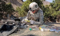 U.S. Army Staff Sgt. Michael Wade, company intelligence support team member and native of Auburn, MA, assigned to Troop A, 1st Squadron, 33rd Cavalry Regiment, inventories items found buried at a weapons cache during a joint air-assault mission with Afghan National Security Forces in the mountains of Khowst Province Oct. 8th. (Photo by U.S. Army Staff Sgt. Brent C. Powell, 3rd Brigade, 101st Airborne Division)