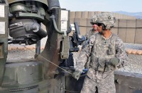 U.S. Army Spc. Justin A. Brown of Oklahoma City, a cannoneer with 1st Section, 1st Platoon, Battery A, 2nd Battalion, 320th Field Artillery Regiment, simulates pulling his lanyard hooked up to the howitzer at Forward Operating Base Garcia  Sept. 29th. (Photo by U.S. Army Spc. Richard Daniels Jr., Task Force Bastogne Public Affairs)