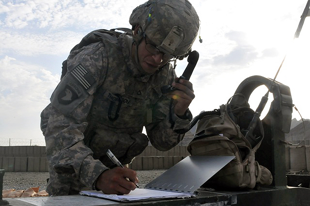 U.S. Army Pfc. Jerimah E. Thompson of Atlanta, a radio telephone operator with 1st Section, 1st Platoon, Battery A, 2nd Battalion, 320th Field Artillery Regiment, simulates pulling his lanyard hooked up to the howitzer at Forward Operating Base Garcia Sept. 29th. (Photo by U.S. Army Spc. Richard Daniels Jr., Task Force Bastogne Public Affairs)