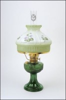 A green glass lamp manufactured by the Aladdin Mantle Lamp Company