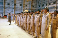 A formation of Afghan soldiers stand next a formation of U.S. Soldiers as they salute show respect for their respective national anthems during a transfer of authority ceremony Oct. 9th at Kabul International Airport. (Photo by U.S. Army Sgt. Monica K. Smith, 3rd Combat Aviation Brigade, Task Force Falcon)