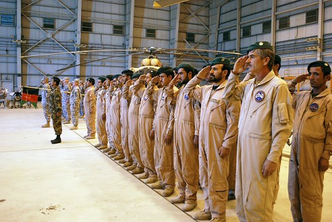 A formation of Afghan soldiers stand next a formation of U.S. Soldiers as they salute show respect for their respective national anthems during a transfer of authority ceremony Oct. 9th at Kabul International Airport. (Photo by U.S. Army Sgt. Monica K. Smith, 3rd Combat Aviation Brigade, Task Force Falcon)