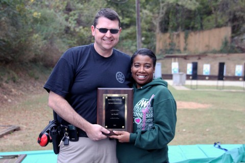 John Smith receiving the first place trophy from Trina Scott