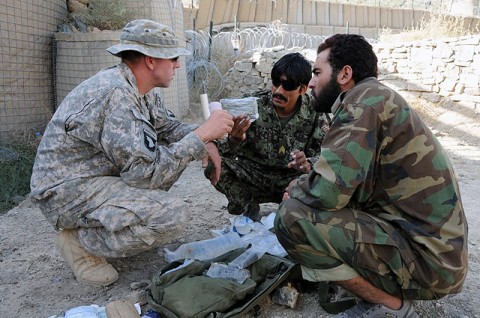 U.S. Army Spc. David A. Bryan, a combat medic, checks an Afghan National Army combat medic’s aid bag during a class given to the ANA by U.S. Army medics Sept. 27th at Combat Outpost Munoz. Bryan took the time to go through each item in the bag, explained the importance of carrying only the items you need while on patrol and replenished the ANA medic’s bag with new supplies. (Photo by U.S. Army Spc. Luther L. Boothe Jr., Task Force Currahee Public Affairs Office)