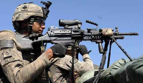 U.S. Army Staff Sgt. Jimmy L. Schumacher of Savannah, TN, a squad leader with 1st Platoon, Company A, 1st Battalion, 327th Infantry Regiment, Task Force Bulldog, scans the area from a mountaintop observation post in eastern Afghanistan’s Kunar Province after being shot at by an enemy sniper Sept. 21st. (Photo by U.S. Army Staff Sgt. Gary A. Witte, 300th Mobile Public Affairs Detachment)