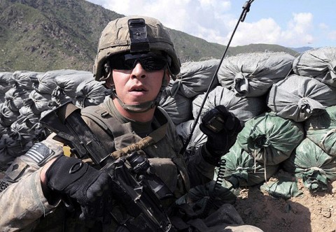 U.S. Army Spc. William B. James of Columbus, GA, forward observer for 4th Platoon, Company D, 1st Battalion, 327th Infantry Regiment, Task Force Bulldog, calls in mortar fire during a more than three-hour fire fight at the Shege East Afghan National Police checkpoint Sept. 18. (Photo by U.S. Army Staff Sgt. Gary A. Witte, 300th Mobile Public Affairs Detachment)