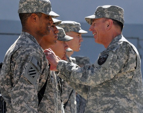 U.S. Army Gen. David Petraeus, commander of International Security Assistance Forces and of U.S. Forces in Afghanistan, awards servicemembers the Humanitarian Service medal during a ceremony held at Bagram Airfield, Afghanistan, Oct. 3rd. (Photo by U.S. Army Sgt. Scott Davis, Regional Command-East Public Affairs)