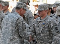 U.S. Army Gen. David Petraeus, commander of International Security Assistance Forces and of U.S. Forces in Afghanistan, awards servicemembers the Humanitarian Service medal during a ceremony held at Bagram Airfield, Afghanistan, Oct. 3rd. (Photo by U.S. Army Sgt. Scott Davis, Regional Command-East Public Affairs)