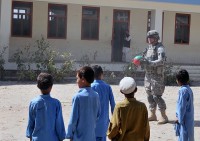 U.S. Army Sgt. 1st Class Derek L. Ashman of San Diego, platoon sergeant of 1st Platoon, Company D, 2nd Battalion, 327th Infantry Regiment, Task Force No Slack plays volleyball with local Afghan children after a Sept. 26th key leader engagement. (Photos by U.S. Army Spc. Richard Daniels Jr., Task Force Bastogne Public Affairs)