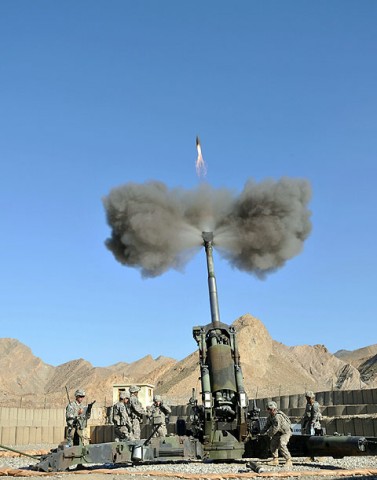 U.S. Army Soldiers with 1st Section, 1st platoon, Battery A, 2nd Battalion, 320th Field Artillery Regiment, Task Force Balls, hurl a 155 mm round from Combat Outpost Garcia in eastern Afghanistan’s Nangarhar Province Oct. 2nd. (Photo by U.S. Army Sgt. Albert L. Kelley, 300th Mobile Public Affairs Detachment)