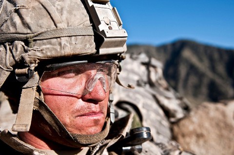 Scanning the horizon, U.S. Army Cpl. Justin L. Gessert, an infantry team leader from Marshfield, WI, assigned to Company C, 2nd Battalion, 327th Infantry Regiment, Task Force No Slack, sits in his fighting position on a remote hilltop in the Shal Valley in eastern Afghanistan's Nuristan Province Nov. 8th. (Photo by U.S. Army Staff Sgt. Mark Burrell, 210th Mobile Public Affairs Detachment)