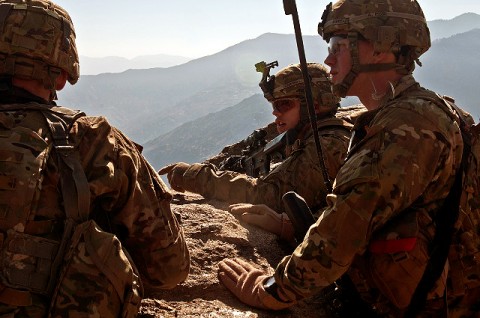 U.S. Army Staff Sgt. Dustin C. Campbell (middle), a squad leader from Knoxville, TN, points out a possible egress route to U.S. Army Capt. Sean T. Hinrichs (right), a platoon leader from East Moriches, NY, and U.S. Army Sgt. Nathan W. English (left), a forward observer from Mobile, AL, during the final phase of Operation Bulldog Bite above the Pech River Valley in eastern Afghanistan’s Kunar Province Nov. 23rd. (Photo by U.S. Army Staff Sgt. Mark Burrell, Task Force Bastogne Public Affairs)