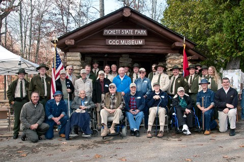 Environment and Conservation Commissioner Jim Fyke (center) joined former CCC workers from across the state, along with Tennessee State Parks officials, at Pickett State Park’s dedication of the new Civilian Conservation Corps Museum. (Photo by Terry Bonham)