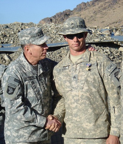 Combat Outpost Margah, Afghanistan – U.S. Army Gen. David H. Petraeus (left), International Security Assistance Force commander, shakes the hand of U.S. Army Sgt. Donald Starks from Grayling, MI, after awarding him the Silver Star for his actions during an Oct. 30th attack.  (Photo by U.S. Army Capt. Rob Quint, Combined Joint Task Force 101)