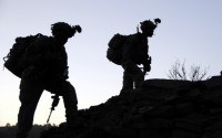 Task Force White Currahee Soldiers from E Company, 2nd Battalion, 506th Infantry Regiment, 4th Brigade Combat Team, 101st Airborne Division, take a break from walking up the side of a mountain in Charbaran District here during the early morning hours Oct. 27th. (Photo by U.S. Army Spc. Luther L. Boothe Jr., Task Force Currahee Public Affairs Office)