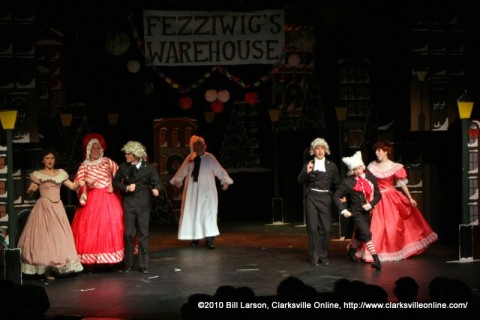 Ebenezer Scrooge at Fezziwig's Warehouse. Mrs. Fezziwig is center left, Mr. Fezziwig is center right