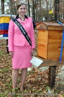 Lisa Schluttenhofer standing next to a beehive in Montgomery County Lisa Schluttenhofer standing next to a beehive in Montgomery County