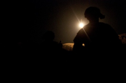 KUNAR PROVINCE, Afghanistan – U.S. Army Sgt. James T. Schmidt, Task Force No Slack, waits for an air assault mission to begin by the dying light of a flare at Forward Operating Base Joyce in eastern Afghanistan’s Kunar Province, Nov. 7th. (Photo by U.S. Army Staff Sgt. Mark Burrell, 210th Mobile Public Affairs Detachment)